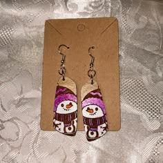 Brand New With The Tags! Handmade By Myself. Wooden Earrings These Earrings Are Hand Painted And Also Hand Wood Engraved These Are Handmade And Painted Snowman Earrings They Are One Of A Kind! Amazing For Any Occasion. Please Note That This Design On The Earrings Is Hand Painted I Have 1 Available! Before Submitting An Offer Please Keep In Mind The Time And Effort It Took Into Making Each Pair Of Earrings Wooden Earrings Diy Handmade, Festive White Earrings For Winter, Cute Hand Painted Earrings As Gift, White Festive Earrings For Winter, Wood Christmas Earrings, Artisan Hand Painted Earrings For Gift, Wooden Christmas Earrings, Hand Painted Wooden Christmas Earrings, Unique Hand Painted Purple Earrings