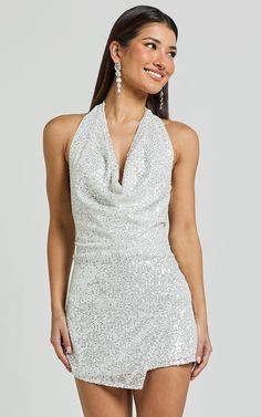 Cynthina Mini Dress - Sequin Cowl Halter Neck Wrap Dress in Silver | Showpo USA Elegant Sparkling Mini Dress For Night Out, Sparkling Mini Dress For Date Night And Holiday, Shiny Summer Dresses For Party, Fitted Shiny Dresses For Party Season, Fitted Dresses With Shine For Party Season, Summer Party Dresses With Shine, Shiny Summer Party Dresses, Holiday Party-ready Shimmer Dresses, Silver Backless Mini Dress For Spring