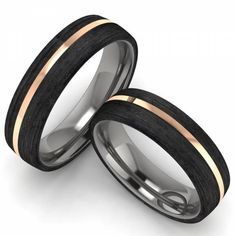 two wedding rings with black wood inlays and rose gold accents, set against a white background