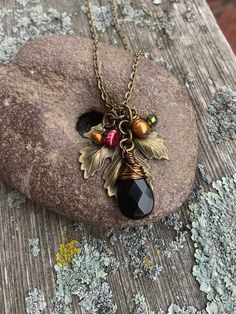 "Autumn season is coming to this parched land and I am so ready to break out my longer jeans, warmer layers and 🎃 pumpkin spice everything! My Falling Leaves jewelry set is the perfect addition for these cooler days! The earthy warm red and copper colors of the hand wire wrapped pearls and crystals against the bronze textured leaf pendant is stunning. I have two varieties of earrings to choose from.  Earring - https://www.etsy.com/listing/1580247891/ Earring - https://www.etsy.com/listing/15802 Autumn Necklace Fall Jewelry, Nature-inspired Brown Pendant Necklace, Nature-inspired Brown Pendant Jewelry, Nature-inspired Brown Gemstone Bead Necklace, Autum Leaf Necklace, Fall Jewelry Trends, Leaves Jewelry, 2024 Jewelry, Thanksgiving Jewelry