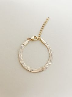 This piece has been in the works for awhile and I am so happy to finally have it available! 4mm herringbone chain bracelet for sizes newborn to adult. This is a perfect sleek and everyday look bracelet with the perfect amount of gold and sparkle! Each bracelet has 1.5-2 inches of extra chain to last for years!  These are perfect for birthdays, holidays, weddings, any special occasion. It is a perfect statement piece.  Water Resistant - WATERPROOF- You can wear gym, pool, shower or everywhere *Ta Gold Bracelets For Birthday, Gold Metal Bracelets For Birthday, Gold Metal Birthday Bracelets, Metal Snake Chain Bracelet As Gift, Snake-shaped Metal Bracelets As Gifts, Gold Dainty Chain Bracelet For Birthday, Dainty Gold Chain Bracelet For Birthday, Trendy Jewelry Gift With Snake Chain, Adjustable Snake Chain Bracelet With Lobster Clasp