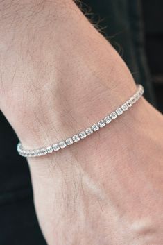 This stunning Asscher-Cut Cubic Zirconia Tennis Bracelet is a masterpiece of craftsmanship and style, crafted and produced in Bangkok, Thailand.Each Asscher cut cubic zirconia stone is meticulously set to showcase its unique brilliance and clarity, creating a symphony of light with every movement. Crafted from the finest sterling silver, this bracelet boasts a luxurious rhodium plating, enhancing its durability and adding an extra layer of shine.The easy button clasp ensures a comfortable fit.Ea Bezel Set Diamond Ring, Bezel Set Diamond, Asscher Cut, Silver Pieces, Bangkok Thailand, Tennis Bracelet, Box Chain, Bezel Setting, Pure Silver