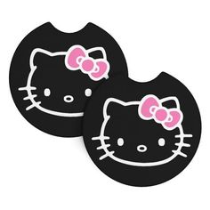 two black hello kitty coasters sitting on top of each other, one with a pink bow