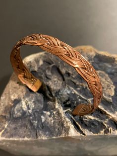 Beautiful handmade pure copper braided design healing cuff bracelet from Nepal.Adjustable,wearable & interesting hand work design and style healing cuff bracelet. Copper helps maintain healthy bones, blood vessels, nerves, and immune function, and it contributes to iron absorption. Sufficient copper in the diet may help prevent cardiovascular disease and osteoporosis, too. Copper was the first metal ever used by humans. Middle Eastern artisans of the 5th & 6th millennia B.C fashioned this copper Adjustable Copper Braided Bohemian Bracelet, Adjustable Copper Bohemian Braided Bracelet, Adjustable Brown Copper Braided Bracelets, Adjustable Bohemian Copper Braided Bracelet, Adjustable Copper Artisan Cuff Bracelet, Artisan Copper Cuff Bracelet With Adjustable Fit, Adjustable Artisan Copper Cuff Bracelet, Artisan Copper Cuff Bracelet Adjustable, Artisan Adjustable Copper Cuff Bracelet