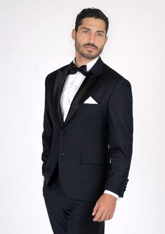 Look your best in the Dean Dark Navy Twill Tuxedo. This timeless design exudes sophistication and elegance for any formal occasion. Crafted from luxurious twill fabric, the dark navy shade adds an air of subtle class and exclusivity. Be the envy of the night in this classic, tailor-made piece. Luxury Blue Suits For Black-tie Events, Classic Satin Suits For Semi-formal Occasions, Classic Tailored Satin Suits, Luxury Fitted Navy Tuxedo, Elegant Navy Blazer For Wedding, Elegant Fitted Navy Tuxedo, Elegant Fitted Navy Blazer, Navy Notch Lapel Tuxedo For Formal Occasions, Navy Notch Lapel Tuxedo For Wedding