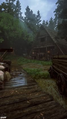 an old wooden house in the woods with lots of logs and hay on the ground