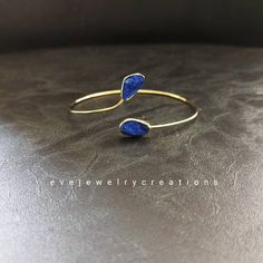 Hand made lapis lazuli bangle bracelet, with a 18k yellow gold finish. Blue Brass Bracelet, Gold Lapis Lazuli Bracelets For Gift, Gold Lapis Lazuli Bracelet With Gemstone, Gold Lapis Lazuli Gemstone Bracelet, Always And Forever, Druzy Ring, Bangle Bracelet, Lapis Lazuli, Gold Finish