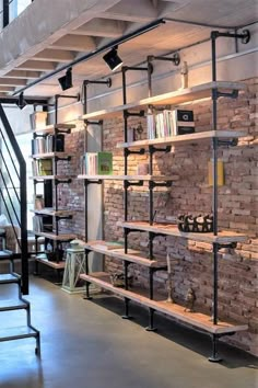 a brick wall with shelves and ladders on it