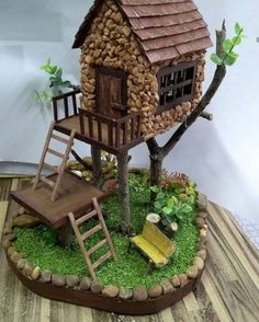 a small tree house made out of logs and wood with a ladder to the roof