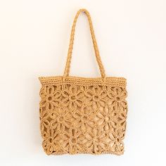 IN STOCK FAST SHIPPING FROM LOS ANGELES Artfully designed for your summertime getaways, the Elena Handbags Floral Design Straw Beach Tote adds a touch of charm and elegance to any beachwear ensemble. Crafted from lightweight straw and woven with intricate floral designs, this bag is the perfect companion for yoga, the market place, and, of course, the beach. Elegant and tasteful, this sophisticated tote is sure to turn heads. Size is approximately 28cm wide x 25cm tall (11in x 10in) Designer Style ID: 8475 Straw Beach Tote with Floral Design, Handmade Straw Woven Shoulder Bag, Summer Beach Bag Sand-colored Straw Bag For Summer Beach, Beachy Sand-colored Straw Bag, Lightweight Beige Crochet Bag For Beach, Beige Lightweight Straw Bag For Beach, Summer Beige Crochet Bag For Vacation, Beige Summer Crochet Bag For Vacation, Lightweight Beige Straw Bag For Beach, Bohemian Lightweight Beach Bag For Vacation, Lightweight Brown Bohemian Beach Bag