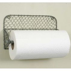 a toilet paper holder with chicken wire on it