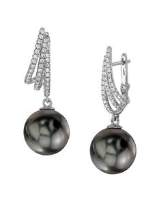 These exquisite earrings feature 11mm high-quality Tahitian South Sea pearls, handpicked for their incredible luster and overtones. The pearls are mounted on the finest 18K gold with .35 carats of dazzling SI clarity diamonds. These earrings come packaged in a beautiful jewelry gift box, perfect for gifting. Luxury Tahitian Pearl Jewelry For Wedding, Luxury Black Pearl Earrings For Anniversary, Classic Tahitian Pearl Earrings For Formal Occasions, Luxury Tahitian Pearl Earrings For Anniversary, Formal Tahitian Pearl Jewelry With Matching Earrings, Elegant Tahitian Pearl Earrings For Anniversary, Elegant Tahitian Pearl Earrings For Formal Occasions, Elegant Tahitian Pearl Earrings For Wedding, Anniversary Tahitian Pearl Drop Earrings