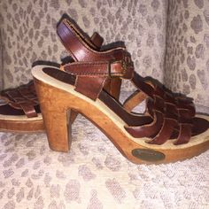 Vtg 1970’s Fanfares. New Never Worn, Handmade Brazilian Leather And Hand Carved Wood Heels. (Imperfections Are Its Character) New Clean Vintage Condition. Deep Oxblood, Burgundy, Rust Woven Huarache Top With A Brass Buckle Strap Around Ankle. Sole Is A Burlap Linens Fabric With No Wear Marks Either On The Sole Or Bottom Of Shoe. (There Are Some Scratches In The Wood From Being Stored In A Box Of Shoes But Could Be Buffed Out With Polish.) Rubber Grooved Sole, 4.25 Wooden Heel With Brass "Fanfares" Emblem Nailed Into Front Side Of Shoe. Labeled "Fanfares Made In Brazil 789 Ee 59 7m As403" Size 7 Retro Sandals With Leather Sole, Retro Leather Sandals With Leather Sole, Retro Brown Leather Sandals, Vintage Round Toe Heels For Spring, Vintage Spring Heels With Round Toe, Spring Vintage Round Toe Heels, Vintage Leather Sandals With Round Toe, Retro Heels With Leather Sole For Spring, Retro Leather Sandals With Block Heel