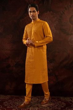 Yellow cotton silk pintuck pattern kurta. Paired with a churidar.
Components: 2
Pattern: Pintuck
Neckline: Stand Collar
Sleeve Type: Full Sleeves
Fabric: Cotton Silk
Color: Yellow
Other Details: 
Concealed button placket
Occasion: Sangeet - Aza Fashions Plain Yellow, Men Kurta, Churidar, Full Sleeves, Pin Tucks, Cotton Silk, Aza Fashion, Button Placket, Full Sleeve