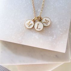 Three Initial Charm Necklace. A special gift for Mom or Grandma this Mothers Day.  An initial for each special child. A personalized gift is always extra special.  Your choice of 3 letter charms. A simple elegant everyday necklace, can be worn alone or layered up with other favourites.  All items will come beautifully presented on a display card and place in an organza gift bag, all ready for gift giving. Details: dimensions: Charm Measures 15mm Please note that some charms have a slightly diffe White Charm Necklaces For Everyday And Mother's Day, Mother's Day Gift Charm Necklace With Letter Beads, White Custom Name Initial Pendant Jewelry, Dainty White Initial Necklace Gift, White Charm Necklaces, White Custom Name Initial Pendant Charm Necklace, White Custom Name Jewelry With Initial Pendant, White Initial Pendant Necklace For Anniversary, Everyday White Jewelry With Initials