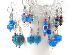 A handmade pair of millefiori earrings, made to order to your specifications!  This listing features a pair of matched millefiori glass floral beads in your choice of pattern, with glass and plated steel accents, on your choice of hypoallergenic steel, gold plated steel, or sterling silver (stamped .925).  I adore millefiori glass (if it's not obvious from the rest of the site), and use it frequently when designing jewelry. These earrings are simple in design but have a ton of character that I think will appeal to anyone. They're cute, trendy, and eye-catching, while also being lightweight and fun to wear.  Millefiori glass also has a lot of variation from piece to piece, with some flowers being larger or smaller, or having an angle embedded in the glass.  No worries!  I will always choose Blue Flower Earrings For Jewelry Making, Handmade Blue Earrings As A Gift, Handmade Blue Earrings For Gift, Blue Beaded Earrings For Gifts, Blue Earrings With Ear Wire As A Gift, Blue Round Flower Earrings With Ear Wire, Light Blue Beaded Earrings As Gift, Light Blue Beaded Earrings With Ear Wire As Gift, Blue Earrings With Ear Wire For Gift