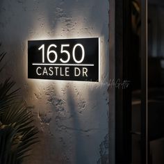 a black and white sign that reads 1560 castle dr on the side of a building