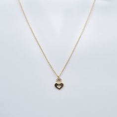 Experience the enchanting allure of our Pave Gemstones Lock Heart Pendant Necklace. Crafted in 10K solid gold, this captivating piece features a heart-shaped pendant adorned with dazzling pave gemstones, adding a touch of glamour and sophistication to any outfit. Necklace Length: 16"Pendant Size: 9 x 12 mm Elegant Heart Necklace With Birthstone And Cubic Zirconia, Elegant Heart Necklace With Birthstone In Cubic Zirconia, Elegant Cubic Zirconia Heart Necklace With Birthstone, Cubic Zirconia Heart Pendant Jewelry With Heart Beads, Cubic Zirconia Heart Pendant Jewelry With Charm, Cubic Zirconia Heart Necklace With Gemstone, Elegant Cubic Zirconia Heart Charm Necklace, Elegant Double Heart Cubic Zirconia Necklace, Diamond Heart Charm Jewelry