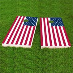 an american flag themed cornhole game set on the grass with two boards facing each other