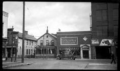 an old black and white photo of a city street