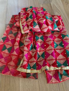 Multicolored Dupatta for women | Phulkari also called Indian Dupatta | Used as Dupatta Stole  Phulkari is traditional artwork of Embroidery indigenous to Punjab region of India. Punjabi women traditionally created it with hand over many days to gift/wear on occasions. This heritage of Punjab is preserved in our Phulkari Dupatta. Hope you have a glimpse of this rich heritage through our Dupattas.  Our feather-soft threads have the lustre that will add a distinct sparkle to your look. Be it your traditional outfit or a modern ensemble, a phulkari dupatta can never go wrong in adding its appeal to your elegance. These timeless pieces will always stay as your prized possessions.  Light Phulkari Dupatta for Women with Full Hand Work All Over It Premium Multi Color Phulkari Dupatta Chunni with M Traditional Red Sets With Mirror Work, Multicolor Semi-stitched Embroidered Fabric For Puja, Red Traditional Wear With Mirror Work For Diwali, Red Traditional Wear For Diwali With Mirror Work, Motif Dupatta For Puja During Navratri, Multicolor Traditional Wear For Puja And Eid, Multicolor Traditional Wear For Eid Puja, Red Bohemian Sharara For Festive Occasions, Red Salwar Kameez With Mirror Work For Traditional Ceremonies