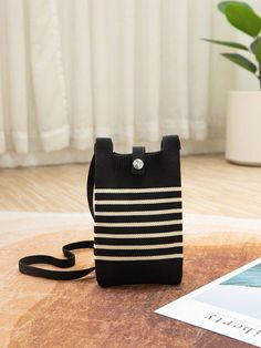 Upgrade your daily accessory with our stunning Black Striped Hollow Knitted Handbag. Perfect for traveling in style Casual Crochet Travel Bag For Mobile Phone, Trendy Knitted Travel Bags, Casual Black Phone Bag With Large Capacity, Casual Large Capacity Black Phone Bag, Casual Black Large Capacity Phone Bag, Large Capacity Black Casual Phone Bag, Travel Crochet Satchel For Mobile Phone, Knitted Travel Shoulder Bag, Knitted Shoulder Travel Bag