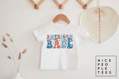 Toddler American Babe Shirt, Kids Fourth of July Shirt, Toddler 4th of July tee, kids USA shirt, Baby Fourth of July shirt, Infant bodysuit BABY & KIDS SHIRTS & BODYSUITS Depending on availability we alternate between the brands Bella + Canvas and Rabbit Skins bodysuits/tees, both have the same fit and are premium quality ► BODYSUIT DETAILS - 5 oz., 100% combed ringspun cotton - 1x1 baby rib - Flatlock stitched seams - Innovative three-snap closure - Double-needle stitched ribbed binding - Easy Playful T-shirt For 4th Of July With Crew Neck, Playful Crew Neck T-shirt For 4th Of July, Playful White T-shirt For 4th Of July, Cute 4th Of July Birthday T-shirt, Pre-shrunk T-shirt For Summer Gender Reveal, Cute Cotton T-shirt For 4th Of July, Short Sleeve T-shirt For Gender Reveal In Summer, Summer Graphic Tee For Gender Reveal, Summer Short Sleeve Tops For Gender Reveal