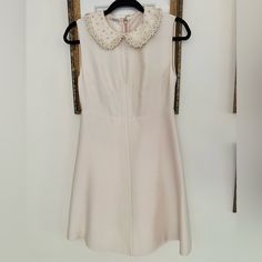 Miu Miu Dress With Embellished Collar Size 40, Fits Like A 4, Ask If You Need Measurements. Gorgeous Collar Embellished With Lace, Pearls, Crystals And Flowers Needs To Be Dry Cleaned, Has Small Untreated Stain On Bottom Hem, Visible In Photo. Crystals And Flowers, Miu Miu Dress, Embellished Collar, A 4, Miu Miu, Stain, Mini Dress, Womens Dresses, Collar