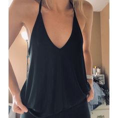 Plain Black Racer Back Tank, Super Stretchy And Comfy. Like Brand New Just Doesn’t Have Tags. Never Worn. Size Xs But Can Definitely Fit A Small. #Freepeopleintamitely Black Halter Top With Built-in Bra For Spring, Black Top With Built-in Bra For Day Out, Black Summer Tops With Built-in Bra, Casual V-neck Tank Top For Date Night, Chic Black V-neck Halter Top, Versatile Black Halter Top With Built-in Bra, Casual Solid Color Backless Tank Top, Casual Stretch Tank Top For Date Night, Versatile Black Summer Tank Top