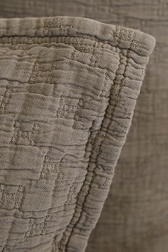 closeup of the textured fabric on an upholstered bed