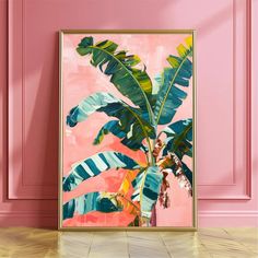 a pink wall with a painting of a banana tree in front of it on the floor