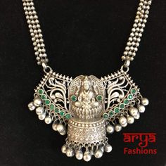 Siya Green Pendant German Silver Tribal Necklace Oxidized Luxury Ceremonial German Silver Necklaces, Heavy Pendant Necklace As A Gift, Long Necklaces For Rituals And Festivals, Navratri Temple Jewelry Pendant Necklace, Temple Jewelry Pendant Necklace For Navratri, Handmade Pendant Necklace For Navratri, Heavy Metal Necklaces For Celebrations, Spiritual Locket Jewelry For Festive Occasions, Bohemian Silver Beads Temple Necklace