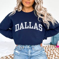 This Dallas sweatshirt is the perfect way to embrace the iconic Dallas skyline. Crafted with premium materials, this cozy Dallas crewneck offers both comfort and a touch of casual style. Whether you're taking in the city's impressive architecture, enjoying local attractions, or simply expressing your love for Dallas, our Dallas shirt is the ideal choice. Ideal for most situations, a unisex heavy blend Texas crewneck sweater is pure comfort. These garments are made from polyester and cotton. This combination helps designs come out looking fresh and beautiful. The collar is ribbed knit, so it retains its shape even after washing. There are no itchy side seams on these sweaters. - 50% cotton, 50% polyester - Medium-heavy fabric (8.0 oz/yd² (271.25 g/m - Loose fit - Sewn-in label Fit Note: If Dallas Cowboy Game Day Outfit, Fan Apparel Sweatshirt With Ribbed Cuffs, Fan Apparel Long Sleeve Sweatshirt With Ribbed Cuffs, Relaxed Fit Fan Apparel Sweatshirt For Winter, Varsity French Terry Crew Neck Sweatshirt, Game Day Crew Neck Sweater With Ribbed Cuffs, Trendy Crew Neck Sweatshirt For Game Day, Fleece Sweatshirt For Fall Fan Apparel, Relaxed Fit Crew Neck Hoodie For College