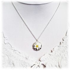 "Handcrafted Easter Lily Locket Necklace featuring hand sculpted white flower and a filigree backdrop on a shiny silver tone locket. -Locket : 2cm (approx. 3/4 inch) silver-plated locket -Interior Locket (for photo) : 13mm (1/2 inch) -Cable Chain : Choose silver plated or upgrade to 925 sterling silver -Length : Choose 16\" or 18\" cable chain View matching collection at: https://www.etsy.com/shop/strandedtreasures/search?search_query=easter+lily Flowers are hand sculpted without molds or paint Sterling Silver Birth Flower Medallion Jewelry, Sterling Silver Medallion Necklace With Flower Charm, Silver Flower Pendant Locket Jewelry, White Flower Pendant Necklace With Birth Flower, Silver Jewelry With Flower Pendant Locket, White Sterling Silver Jewelry With Flower Charm, White Flower Pendant Necklace Gift For Her, White Flower Charm Necklace, Silver Locket Necklace With Flower Charm As Gift