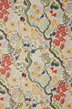 an old wallpaper with colorful flowers and vines on white background, close up view