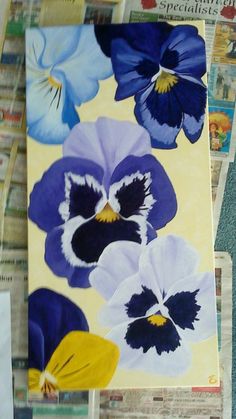 an image of pansies painted on newspaper