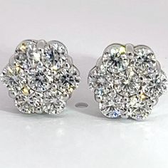 * Size - 8mm * Precious metal - 92.5 sterling silver   * Gemstone - Moissanite  * Carat weight - 2 carats each ear - total weight 4 carats  * Setting - Prong set by hand  * Closure type - Screw Backs  * Guarantee you These are one of the most beautiful earrings you would ever wear ! The shine truly speaks for itself , lots of stones were set in a flower style setting giving you crazy amounts of fire and shine ! We have these earrings IN HAND and ready to ship out SAME DAY ! https://www.youtube.c