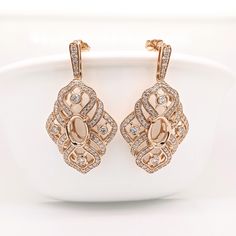 A gorgeous semi mount design for a set of statement earrings with an intricate design and beautiful natural diamond accents! These earrings are complete with pushback closures for comfortable and secure wear.  Specifications: Item Type: Earrings Semi Mount Head size: 10x7mm Shape: Oval Metal: 14k/11.09g Diamond Clarity/Color: SI / G-H Diamond Count/Weight: 170/1.68 cttw SKU: AJE243/7866 These earrings semi mounts are made with solid 14k Gold and natural earth mined SI / G-H Diamonds. FREE SHIPPI Elegant Rose Gold Filigree Earrings, Exquisite Oval Earrings With Prong Setting, Exquisite Oval Prong-set Earrings, Exquisite Oval Prong Set Earrings, Elegant Oval Earrings With Intricate Design, Oval Diamond Earrings With Elegant Design For Formal Occasions, Exquisite Oval Diamond Earrings With Accents, Luxury Oval Bridal Earrings With Prong Setting, Elegant Oval Diamond Earrings For Formal Occasions