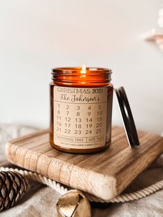 a candle sitting on top of a wooden board