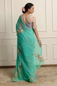 Teal saree featuring floral applique, Swarovski crystals, and silk floss in shikargah motif. Comes with an unstitched blouse piece. - Aza Fashions Applique Saree, Teal Saree, Saree Silk, Embroidered Saree, Blue Saree, Silk Organza, Floral Applique, Silk Chiffon, Blouse Piece