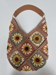 Handmade, Crocheted,  Across the body/shoulder bag. Can be used as either an across the body or a shoulder bag. As you may already have a Strap of your own I offer this handmade bag in a choice of 2 options:- 1. Canvas Across Body Strap 2. Brown Faux Leather Shoulder Strap 3. No strap required; will have small eyelets attached for strap to be added. Main body colour is Taupe with different colour centres per square. Width of bag is approximately 30cm. Length from middle V is approximately 24 cm. Handmade Crossbody Bags For Shopping, Autumn Bag, Granny Square Bag, Boho Handmade, Handmade Tote, Festival Bag, Handmade Bag, Bag Handmade, Body Colour