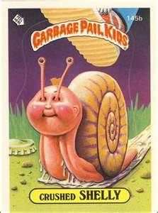 a close up of a card with a snail on it's back and the words garbage pall kids