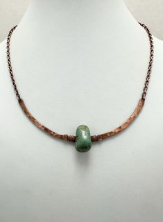 This necklace features a single green turquoise nugget bead that was wire-wrapped to a hammered copper arch frame. The copper arch frame was made from scratch, hand-formed and hammered. The hammering complements the organic look of the turquoise bead. The rest of the necklace consists of a solid copper cable chain, finishing off with a copper hook clasp that was hand formed  from copper wire (see the seventh photo). This genuine green turquoise and copper  hammered necklace is so unique! The design is simple and modern with a rustic look due to the use of hammer copper and the organic shaped green turquoise nugget. The organic look of the design makes it perfect to wear with everyday casual outfits. However, the necklace is also sophisticated enough to dress up. Turquoise is such a versati Wire Wrapped Turquoise, Arch Frame, Hammered Necklace, Everyday Casual Outfits, Copper Necklace, Hammered Copper, Hook Clasp, Genuine Turquoise, Made From Scratch