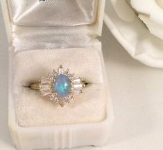 ad eBay - The classic Art Deco setting is 1.5 cm long and 1.5 cm wide. the gorgeous Opal is 8 mm long and 5 mm wide. Ring size O 1/2. (this is a smaller ring size). and set with beautiful white accent stones. and is securely claw set and the whole setting sits 9 mm high. Elegant Blue Opal Promise Ring, Blue Hallmarked Opal Ring For Wedding, Classic Blue Opal Ring As A Gift, Classic Blue Opal Ring As Gift, Classic Blue Opal Ring For Gift, Classic Blue Opal Ring Gift, Classic Blue Opal Ring For Anniversary, Elegant Blue Opal Birthstone Ring, Vintage Blue Opal Ring For Gift