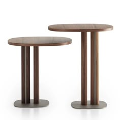 two wooden tables sitting next to each other