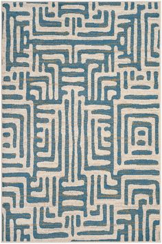 a blue and white rug with an abstract design