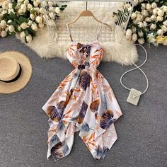 Spaghetti strap vacation dres, irregular, stylish, printed beach dressMaterial:blendedStyle:stylishFeatures:irregular,printedColor:apricot,blue,redSize(cm):free 1inch=2.54cmLength 91, bust 70-84 , waist:76&ltp&gtNote:Due to different measurement methods,there will be 1-3 error(unite:cm), please understand.</p>&ltbr/>&ltp&gtPlease check the size carefully when you choose items,thank you.</p>&ltbr/> Summer Cami Dress With Straps, Floral Print Camisole Dress For Vacation, Camisole Dress With Floral Print For Vacation, Trendy Beach Dress With Spaghetti Straps, White Spaghetti Strap Dress For Beach Party, White Cami Dress For Beach Season, Pink Beachwear Dress With Adjustable Straps, Fitted Cami Sundress For The Beach, Summer Floral Print Camisole Dress