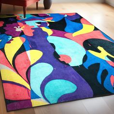 a colorful area rug on the floor in a living room