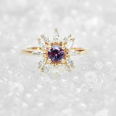 "Cluster round purple sapphire & diamonds engagement ring - Odyssey. Vintage and art deco style. Sapphire is September's birthstone. Listing is of the engagement ring alone. Ring details: ♥ Center stone: Beautiful natural round purple sapphire about 0.5ct. ♥ Side stones: Natural white diamonds, marquise cuts, about 0.60ct, F color, VS clarity. ♥ Material: 14K or 18k, yellow / white /rose solid gold. ♥ Sizes available: 4 - 11. ♥ You can request an IGL Jewelry certificate when ordering. Please Engagement Ring Purple, Round Sapphire Ring, Lavender Sapphire, Purple Sapphire Ring, Sapphire Diamond Engagement, Diamonds Engagement Ring, Jewelry Certificate, Ring Purple, Promise Ring For Her