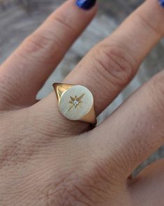 Our solid gold starburst signet ring features a cosmic star set with a sparkling diamond. Choose from 14k, 18k yellow, rose, white gold or platinum. Prefer a colored gemstone in place of the diamond? Just leave us a note at checkout. This ring is a lovely addition to your celestial fine jewelry, and makes a meaningful, timeless (and cool!) gift for your loved ones this holiday season. Details: - Made at our family-run studio in NYC. - Solid 14k, 18k yellow, rose, white gold or platinum -- choose White Gold 14k Signet Ring With Single Cut Diamonds, Star Shaped Signet Ring With Polished Finish, Luxury Single Diamond Signet Ring Gift, Star-shaped Signet Ring For Promise - Fine Jewelry, Star Shaped Fine Jewelry Signet Ring For Promise, 14k Gold Star-shaped Jewelry With Brilliant Cut, Celestial Diamond Jewelry With Single Diamond, 14k White Gold Signet Ring With Single Cut Diamonds, Celestial Gold Signet Ring Stamped 14k